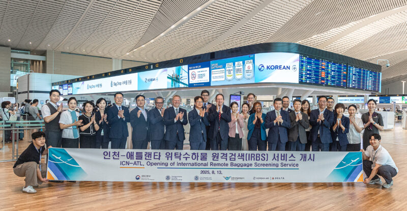 Korean and Delta execs celebrate remote baggage screening pact