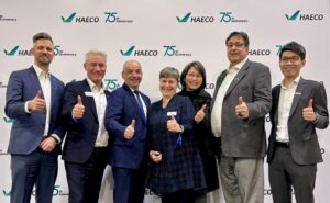 HAECO and Liebherr-Aerospace execs celebrate new MRO pact