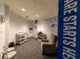 Inside an Ontario International Airport nursing station. A baby-changing table is in view, as is a comfy recliner.