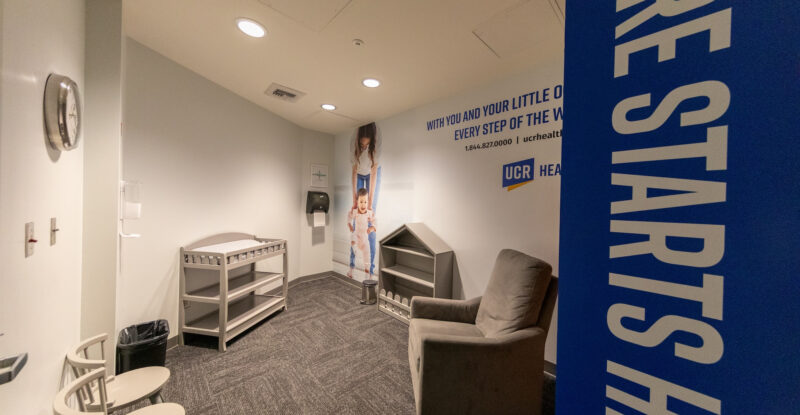 Inside an Ontario International Airport nursing station. A baby-changing table is in view, as is a comfy recliner.