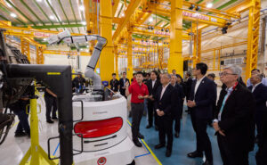 (Front row, from right) Tay Eng Guan, Head of Engine Services, Commercial Aerospace, ST Engineering, Jermaine Loy, Managing Director, Singapore Economic Development Board, and Gan Kim Yong, Singapore Deputy Prime Minister and Minister for Trade and Industry, observing the AI Visual Evaluation Technology solution for engine receiving inspection at ST Engineering’s newest engine maintenance facility in Paya Lebar, Singapore. Behind Minister Gan Kim Yong is (left) Vincent Chong, Group President and CEO, ST Engineering, and (right) Teo Ming Kian, Chairman, ST Engineering.