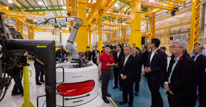 (Front row, from right) Tay Eng Guan, Head of Engine Services, Commercial Aerospace, ST Engineering, Jermaine Loy, Managing Director, Singapore Economic Development Board, and Gan Kim Yong, Singapore Deputy Prime Minister and Minister for Trade and Industry, observing the AI Visual Evaluation Technology solution for engine receiving inspection at ST Engineering’s newest engine maintenance facility in Paya Lebar, Singapore. Behind Minister Gan Kim Yong is (left) Vincent Chong, Group President and CEO, ST Engineering, and (right) Teo Ming Kian, Chairman, ST Engineering.
