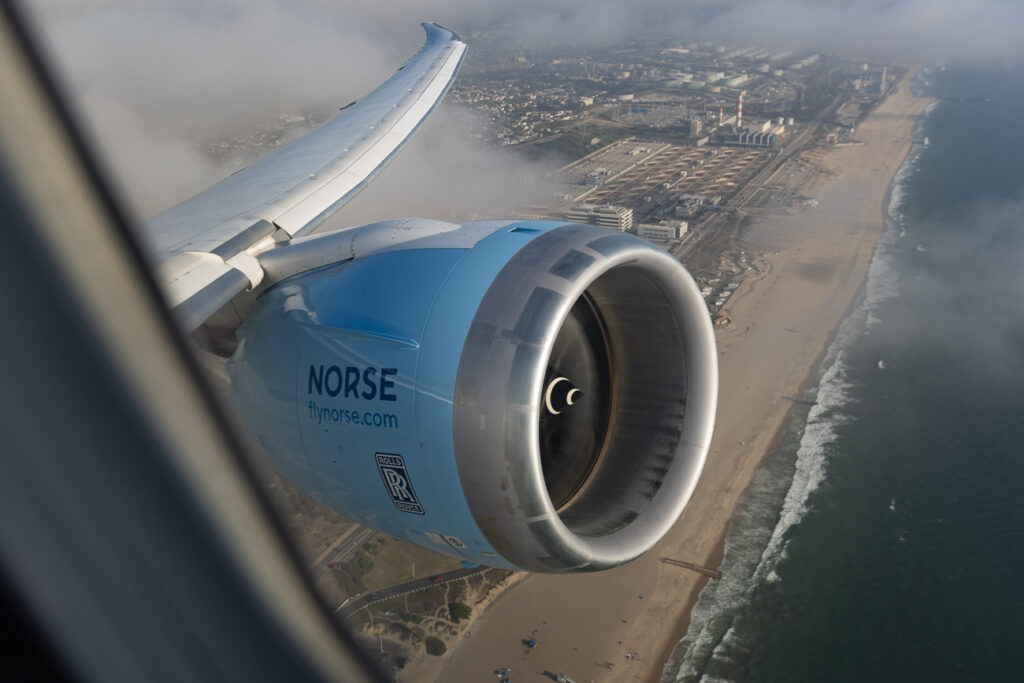 Looking out the window over the city. Also in view is the Norse Boeing 787-9 engine and wing.