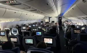 A view from the rear of the Delta 767-400 cabin with virtually all the IFE screens being used