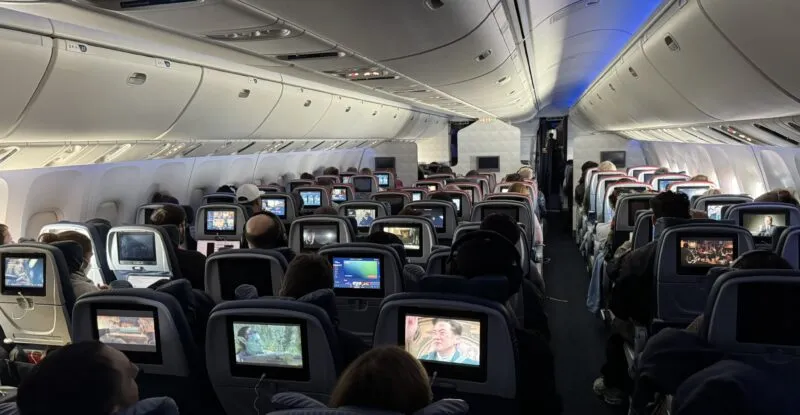 A view from the rear of the Delta 767-400 cabin with virtually all the IFE screens being used