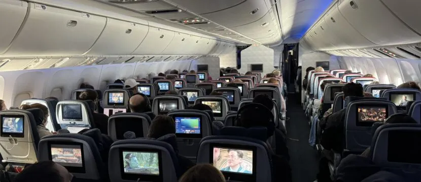 A view from the rear of the Delta 767-400 cabin with virtually all the IFE screens being used