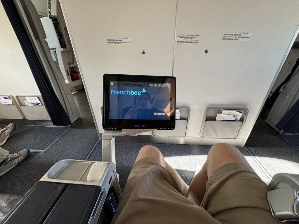 The IFE screen is ejected from the armrest.