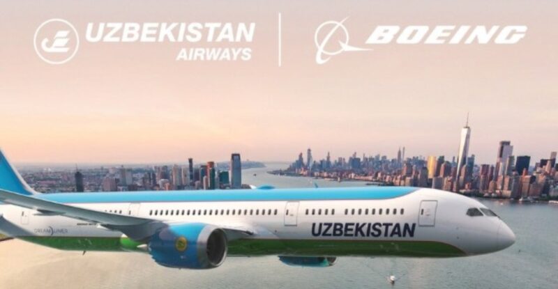 Uzbekistan Airways Dreamliner flying over a city.