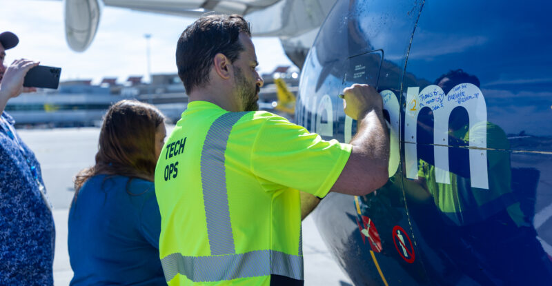 JetBlue employees sign the aircraft