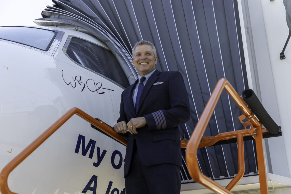 JetBlue COO and pilot standing by an E190