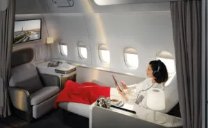 A passenger is lounging in the La Première suite.