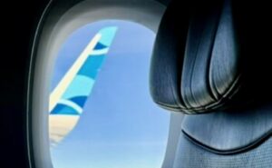 JetBlue wingtip as seen through cabin window