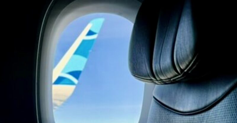 JetBlue wingtip as seen through cabin window