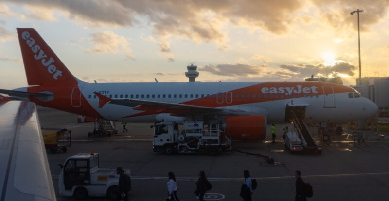 easyjet Airbus A319 at the gate ready for boarding during sunset.