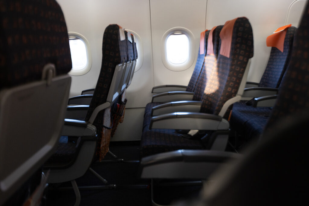 A sideview of the easyjet economy seat in a set of three.