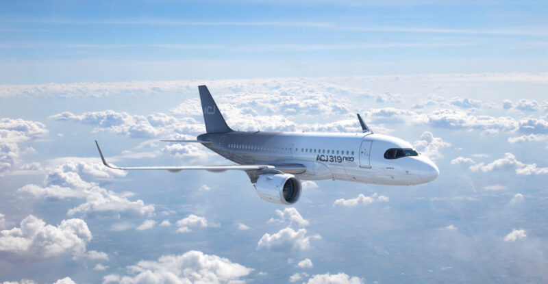 ACJ319neo inflight above white clouds.