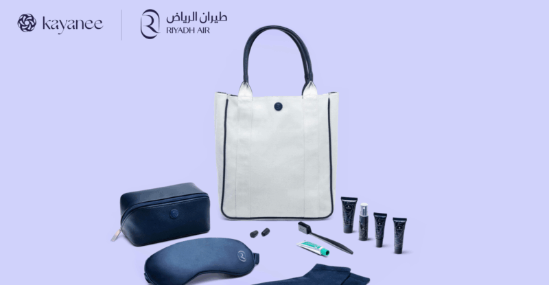 Riyadh Air amenity kit by Kayanee shows some contents such as eye mask, lotions, and a white bag for storage.