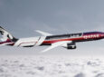 Swizz Beatz and Qatar livery on an aircraft in flight.