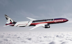 Swizz Beatz and Qatar livery on an aircraft in flight.
