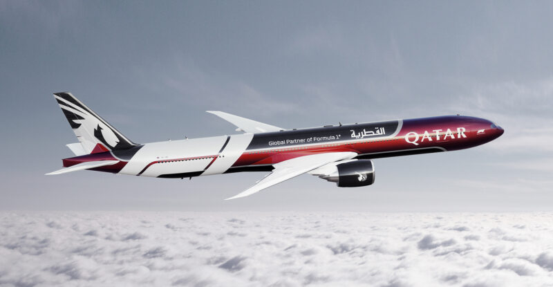 Swizz Beatz and Qatar livery on an aircraft in flight.
