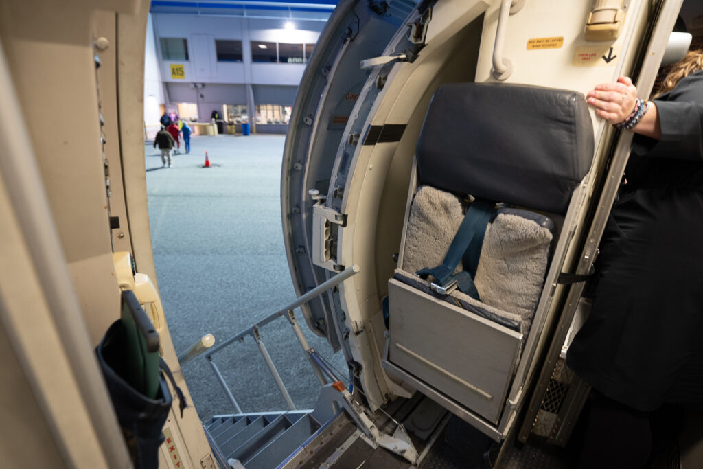 The jump seat as you enter the aircraft.
