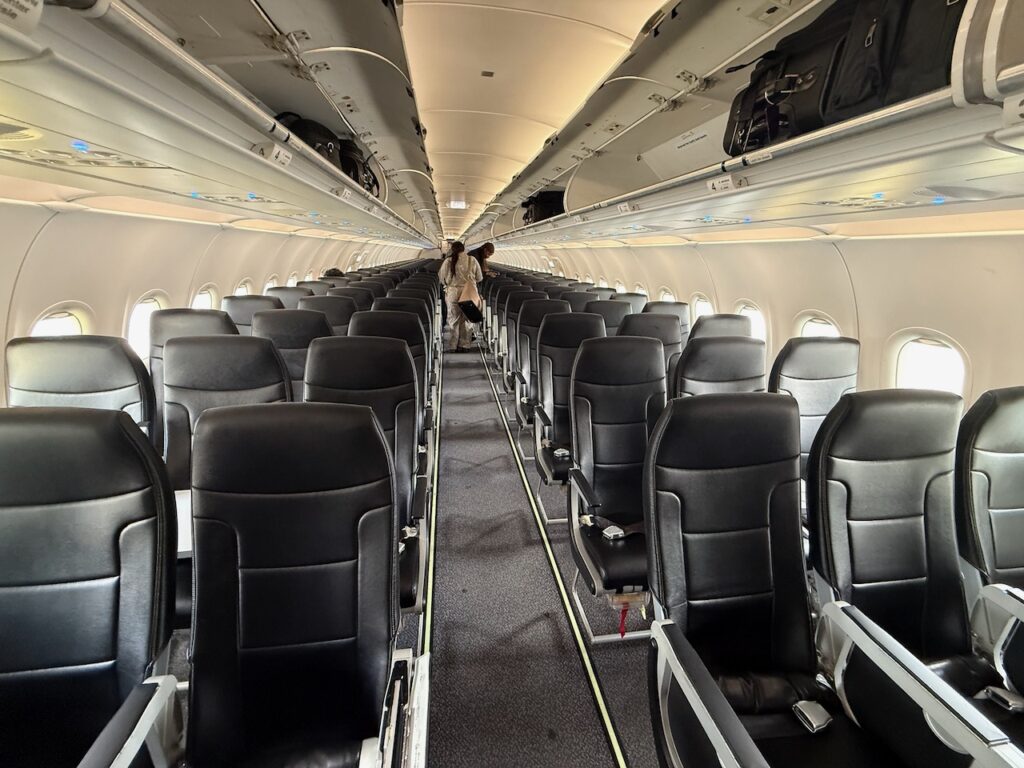 Spirit Airlines economy class cabin with slimline seats.