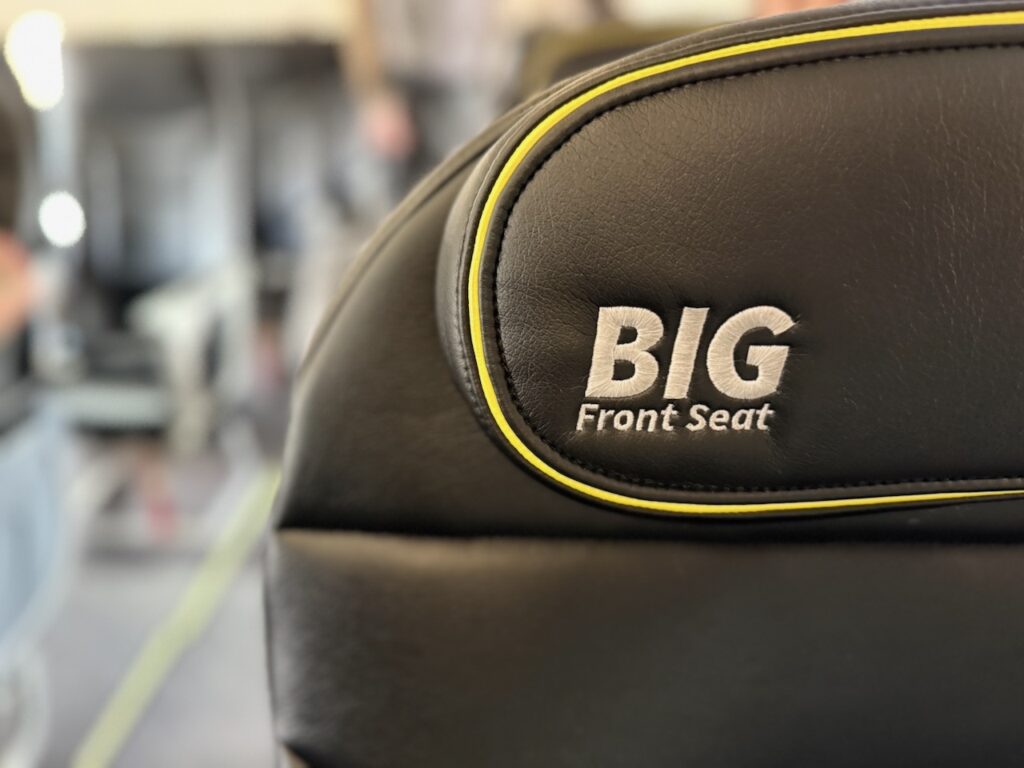 A close up of the headrest that says "Big Front Seat"
