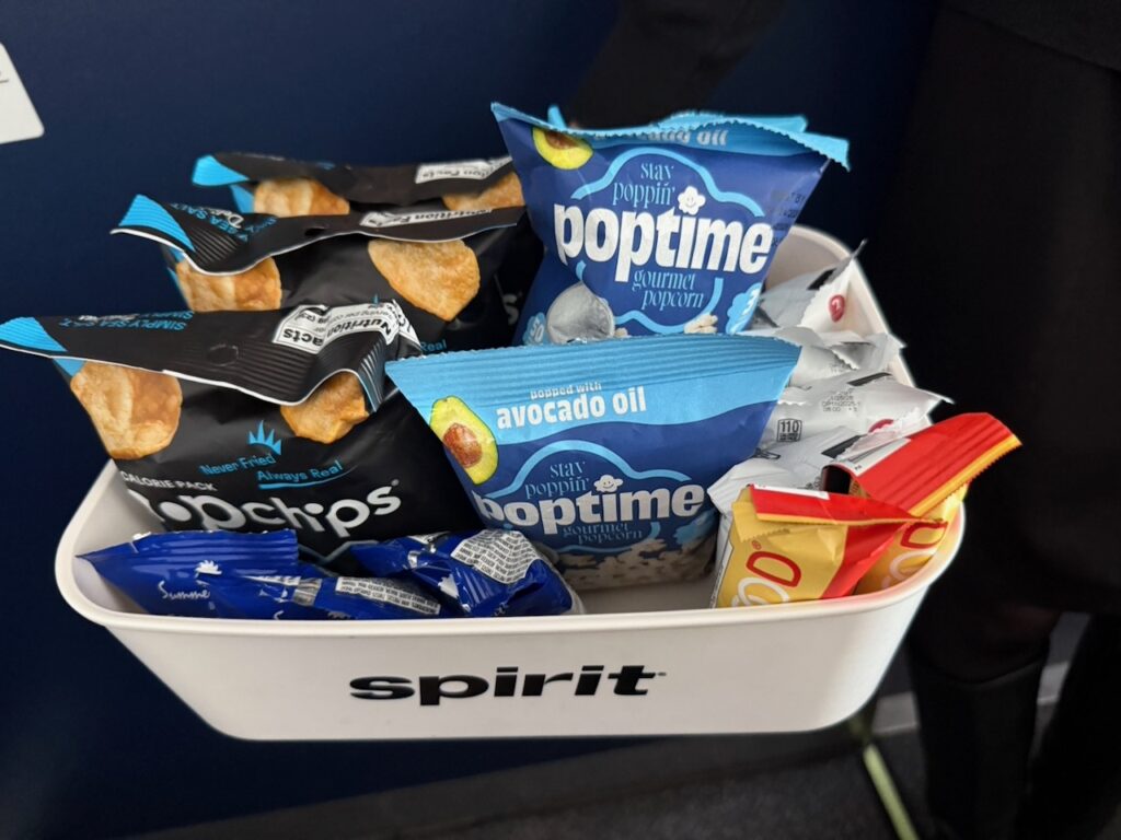 A bin of snacks for the passengers to enjoy.