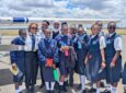 Maseka Kithinji posing with girls in the program.