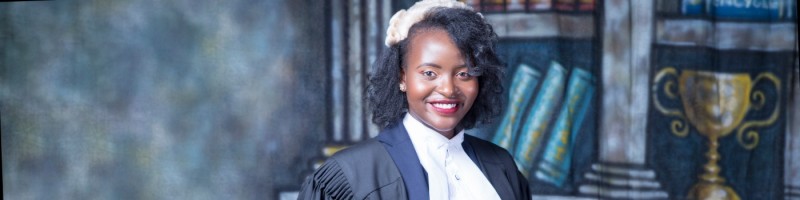 Maseka Kithinji posing for graduation photos