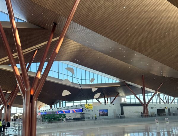 Tree-like metal columns and natural light are signatures of the new terminal.