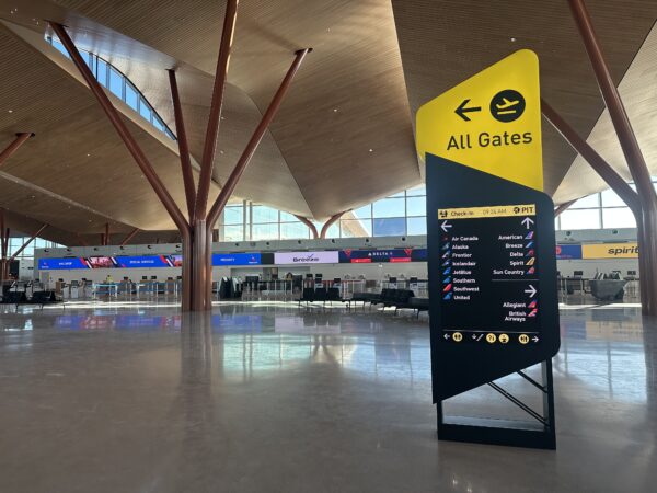 Signage immediately on entering the new terminal in black and gold.