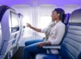 Female passenger enjoys IFE on a United Airlines aircraft
