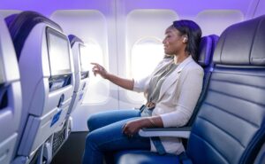 Female passenger enjoys IFE on a United Airlines aircraft