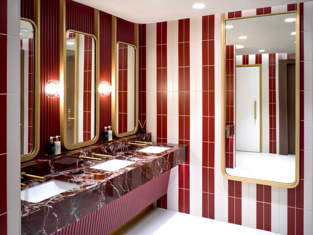 Colourful striped washrooms inspired by traditional Miami deck chairs