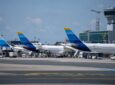 Discover Airlines tails at their gates at the airport.