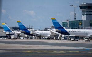 Discover Airlines tails at their gates at the airport.