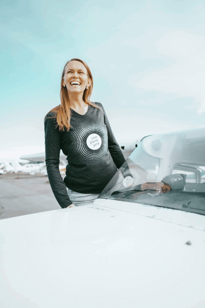 Christine Hannon standing next to an aircraft.