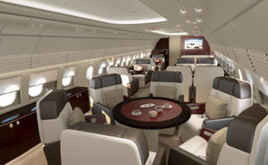 Current (not yet upgraded) ACJ318 Elite cabins of the dining area. A small round table with individual seats around it.