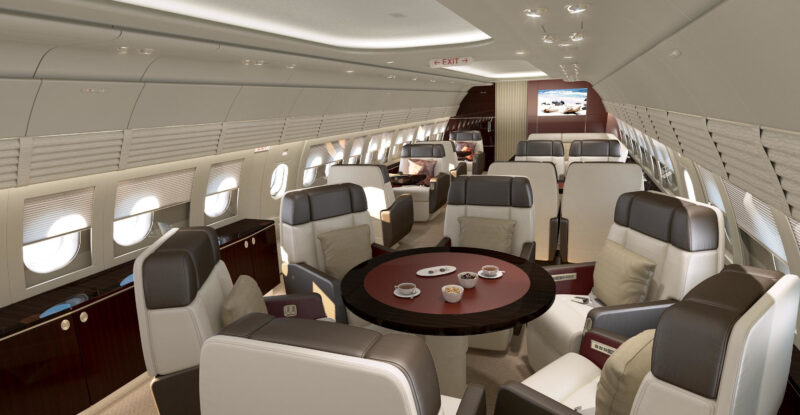 Current (not yet upgraded) ACJ318 Elite cabins of the dining area. A small round table with individual seats around it.