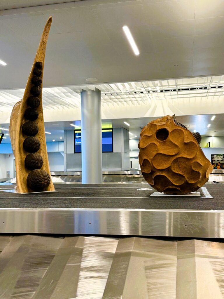 Fredy Huaman Mallqui -baggage wood sculpture