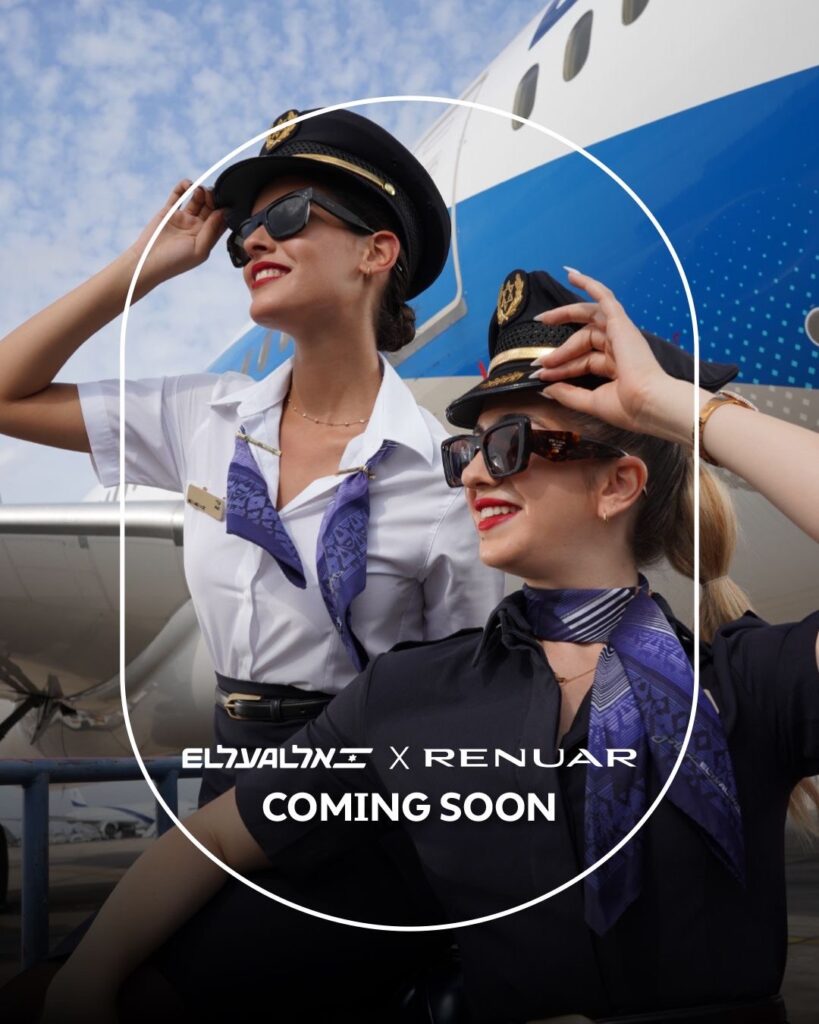 Two female EL AL crew members stand in front of an aircraft.