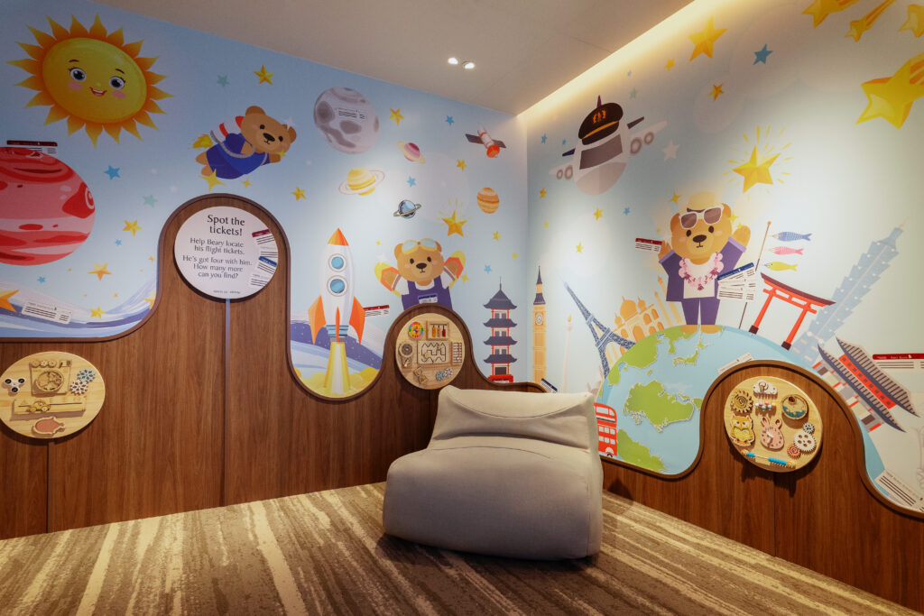 A dedicated Play Room with a travel-themed wall