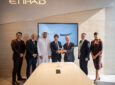 Viasat and Etihad executives celebrate their pact at the Dubai Airshow