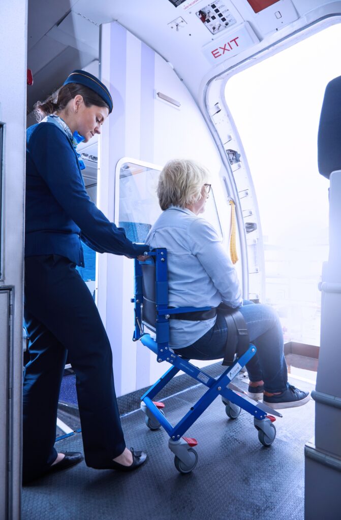 Woman is wheeled on board in the Airchair