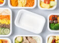 Various Korean Air meals on display in their new plant-based containers.
