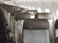 Qantas Economy Plus seats embossed with the branding on an A220