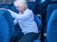 Woman is assisted to her seat with the Airchair for a seat transfer