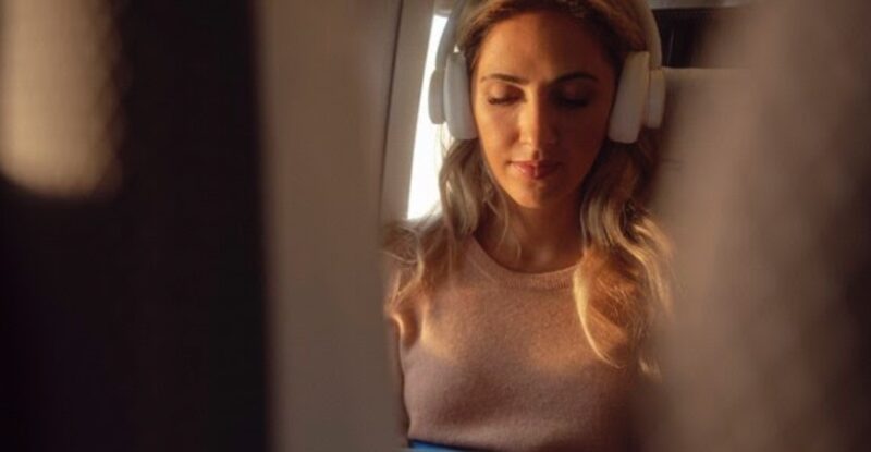 A British Airways customer using Wi-Fi in World Traveller