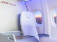 Rendering shows X-Space Table plug-and-play solution that allows airlines to convert seat duos into premium seats, with the aisle-side seat’s back and pan removed and replaced with a side table